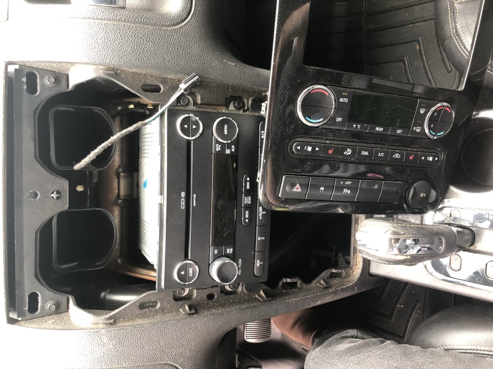 a Ford Taurus X entertainment center, with its front panel taken off